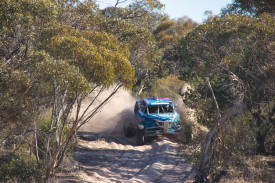 Jourdain Patterson and Perry Compton winds through the sandy track.