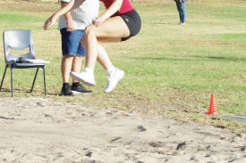 Georgia Evans reaches for the stars as she gives long jump a go.