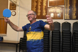 Jason Robinson celebrates after returning a winning smash.