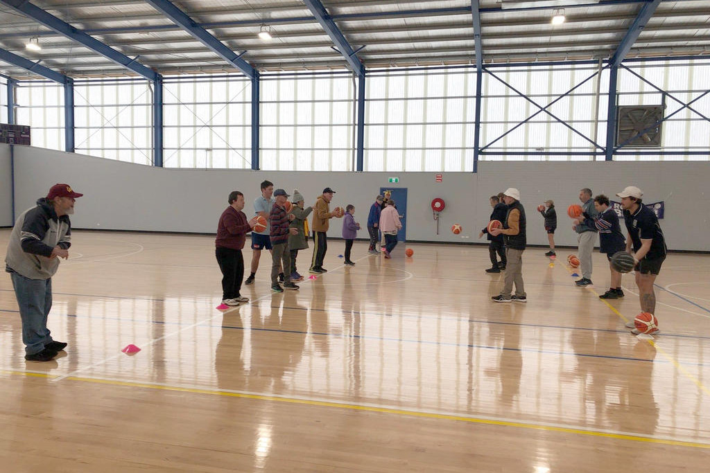 Participants take part in the pass-the-ball activity.