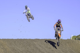 Alex Williams followed by Jesse Kolb clearing the jump.