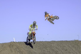 Oskar Kimber clears the jump in front of Baylin Townsend.