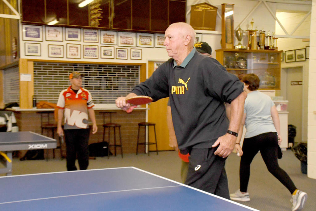 David Baxter makes a forehand return.