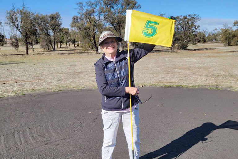 Helen Fisher is all smiles after hole in one.