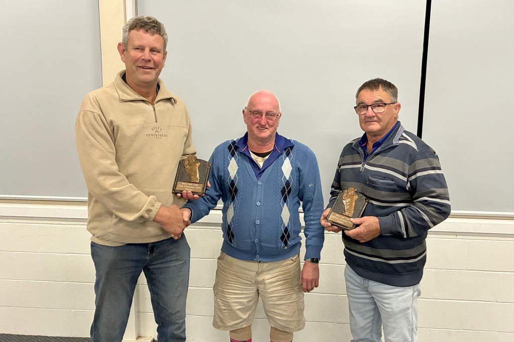 Brim Golf Club Champion Paul Johns is congratulated by captain Rod Gardam and handicap winner Col Appledore.