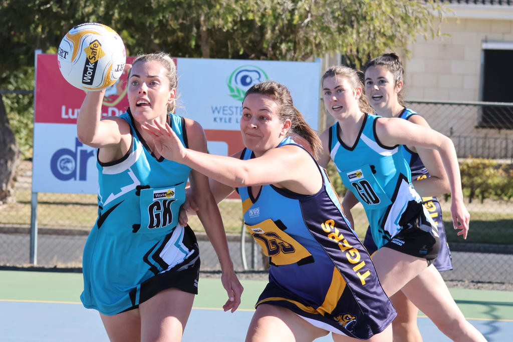 Sydney Thorogood and Emma Beer battle for the ball.