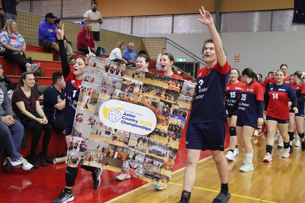 Captains Sophie Quick and Malachy O'Brien lead their teams out during the opening ceremony at last year's junior country championships. This year's tournament is expected to attract teams from right across the state over the AFL grand final weekend.