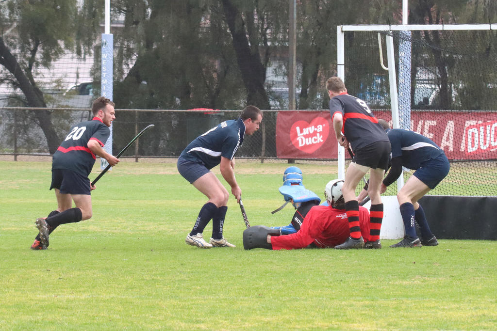 Horsham Hurricanes&rsquo; goalkeeper Colin Williams does whatever he needs to do to block another Tigers attempt at scoring.