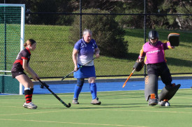 Kaniva goalkeeper Briony Williams kicks the ball away with Sharon Williams in support, and Horsham Jets’ Holly Di Pietro waits to pounce on a loose ball.