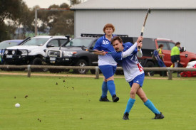 Kaniva Cobras’ Lachie Mills launches the ball out of defence, with Logan Krelle in support.