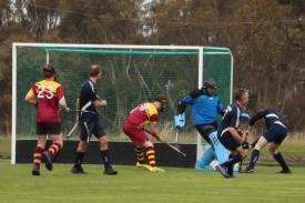 Hoops’ goalkeeper Madisson Bentley clears the ball during one of 11 penalty corners against the Tigers.
