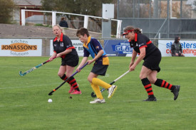 Nhill Thunderbirds’ Barrett Clark runs with the ball, shadowed by Horsham Jets’ Sarah O’Connor and Carmel McFarlane.