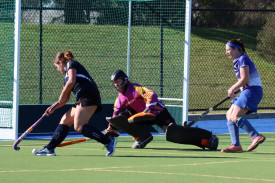 Briony Williams dives to block a scoring attempt by Yanac’s Sarah Chittick.