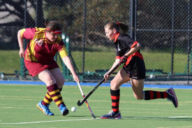 Horsham Jets’ Annabelle Heal jinks the ball past Kate Williamson’s stick.