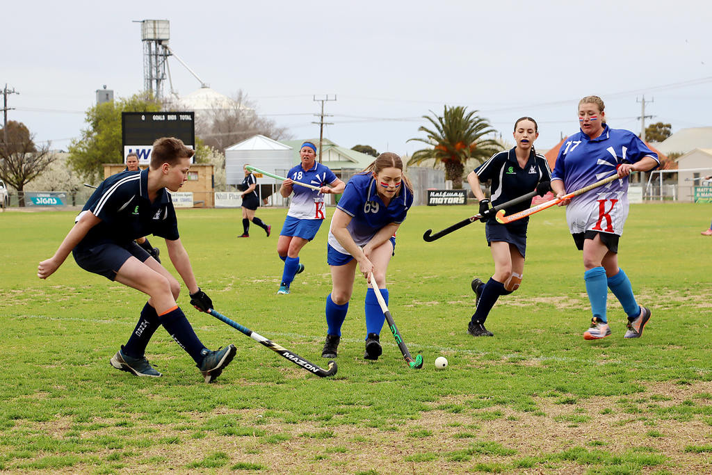 Kaniva&rsquo;s Holly Beattie threads her way past Yanac players Henry Zanker and Mikayla Mackley, and Kaniva teammate Zoey Smith.