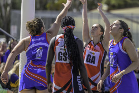 Lucy Bussenschutt reaches in to defend Lavinia Fox’s shot.