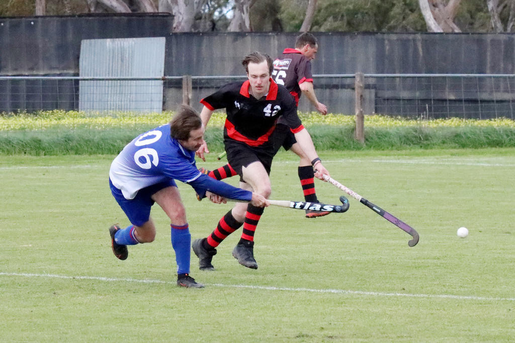 Jordan Clark takes a shot before Horsham Charles Hassell can impede him with a tackle.