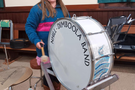 Sophie Blackwood beating the bass drum is the youngest member of the Nhill-Dimboola Band. Sophie is currently in year six at school in Nhill and joined the band at the age of only seven.