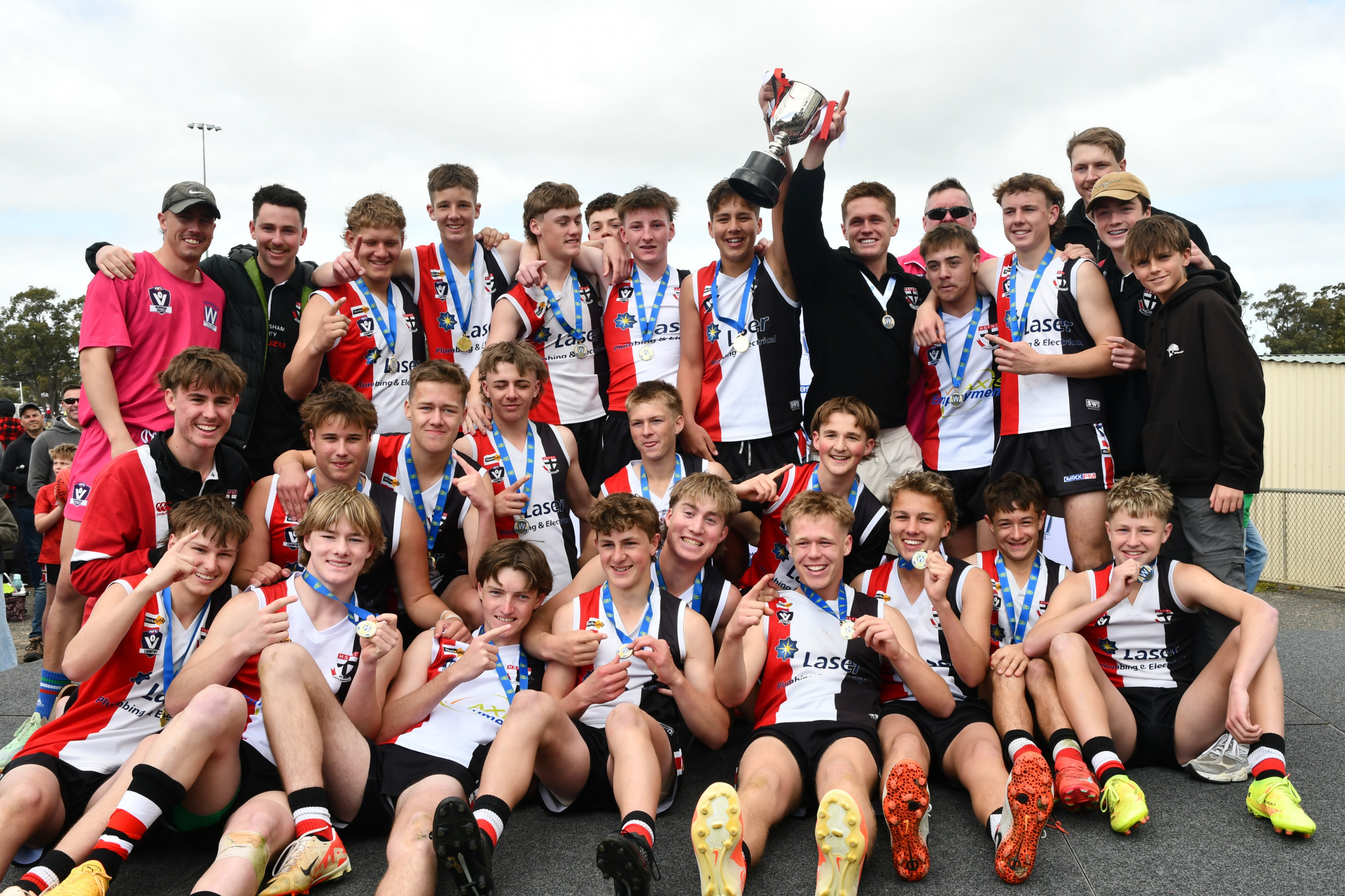 The Horsham Saints celebrate the under 17 WFNL football premiership after defeating Horsham Demons 125-41 in Saturday’s grand final.