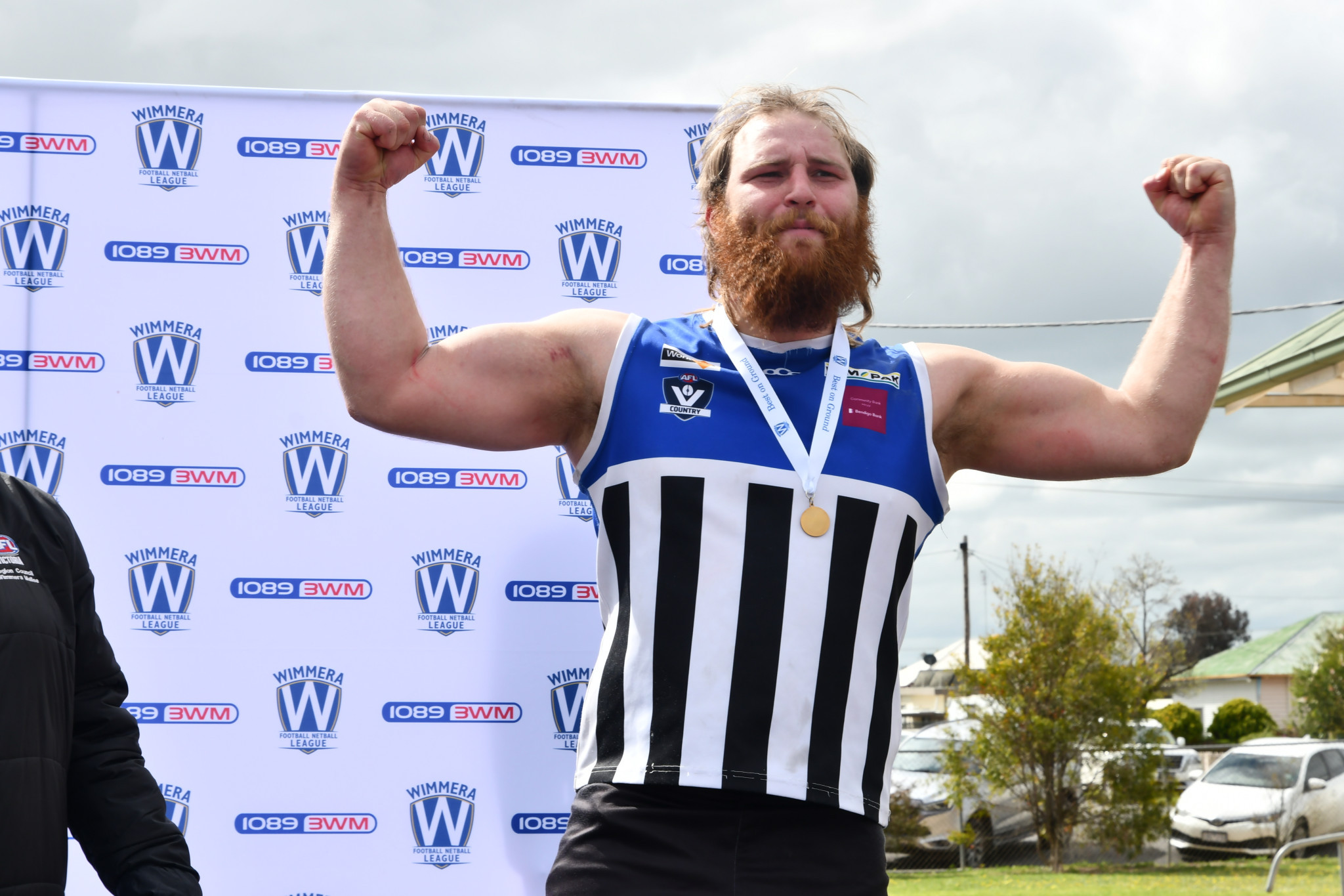 Minyip Murtoa’s Jordan Weyburg flexes with his best-on-ground medal.