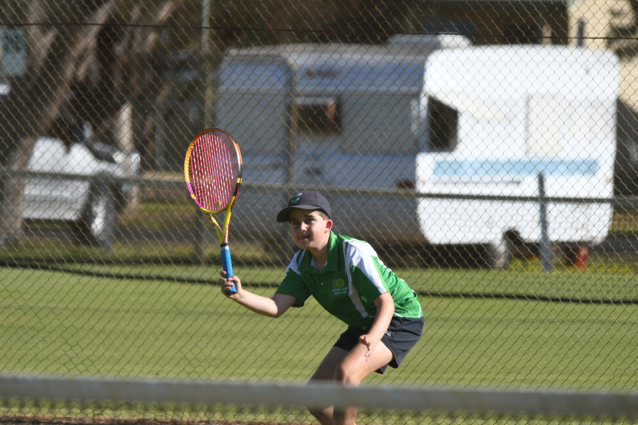 Horsham Lawn’s Nicholas Gillespie lines up his return during a B special doubles clash with Central Park.