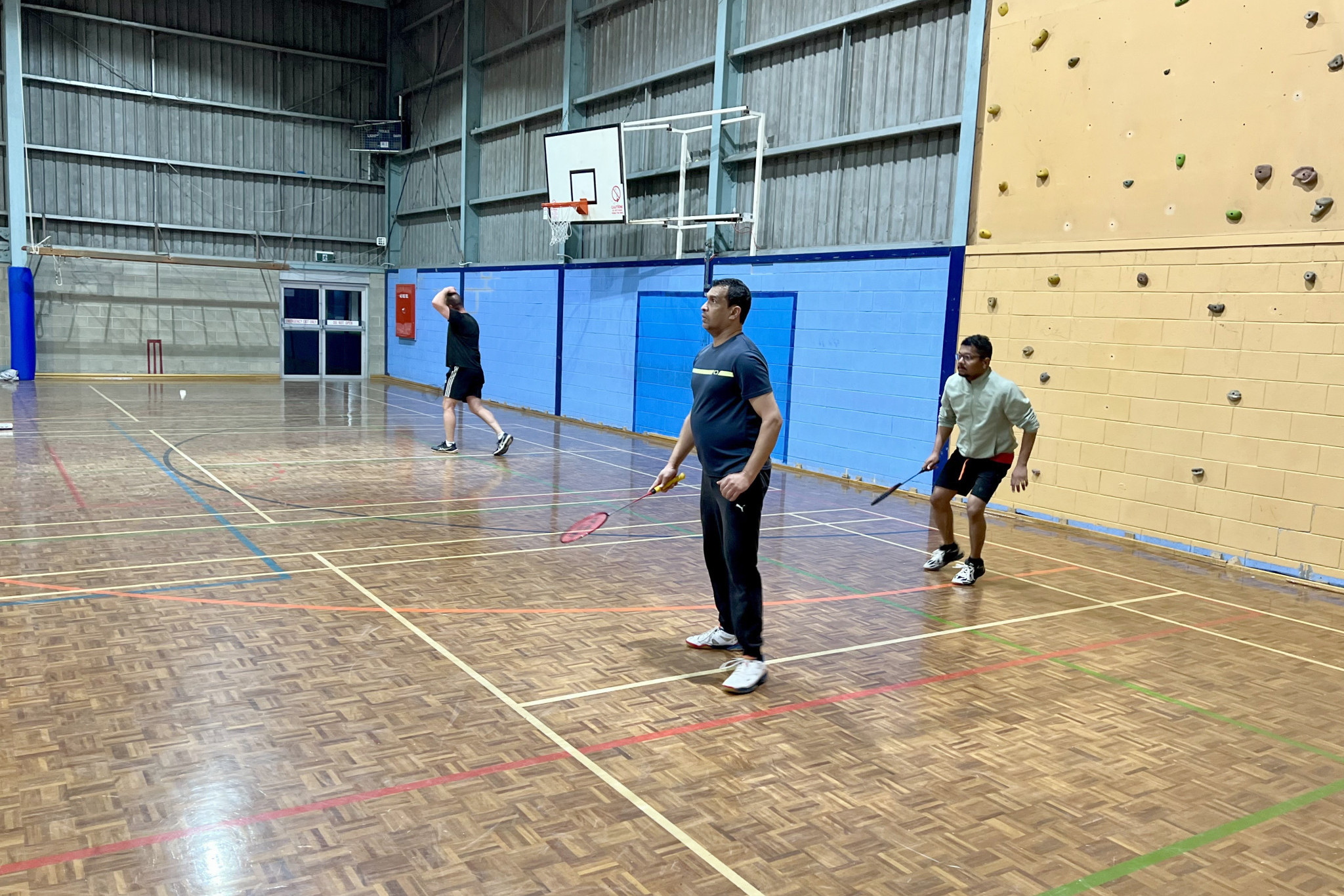A Grade's Johnny Joseph and Subin Mathews waiting for a smash after the serve.