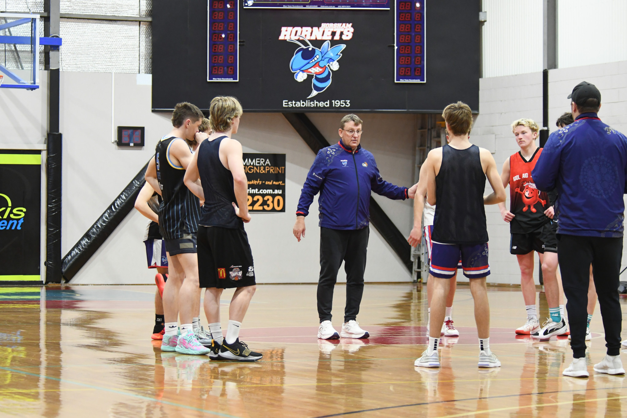 Horsham Hornets' men's basketball coach Scott Benbow talks with his side at one of their preseason training sessions.