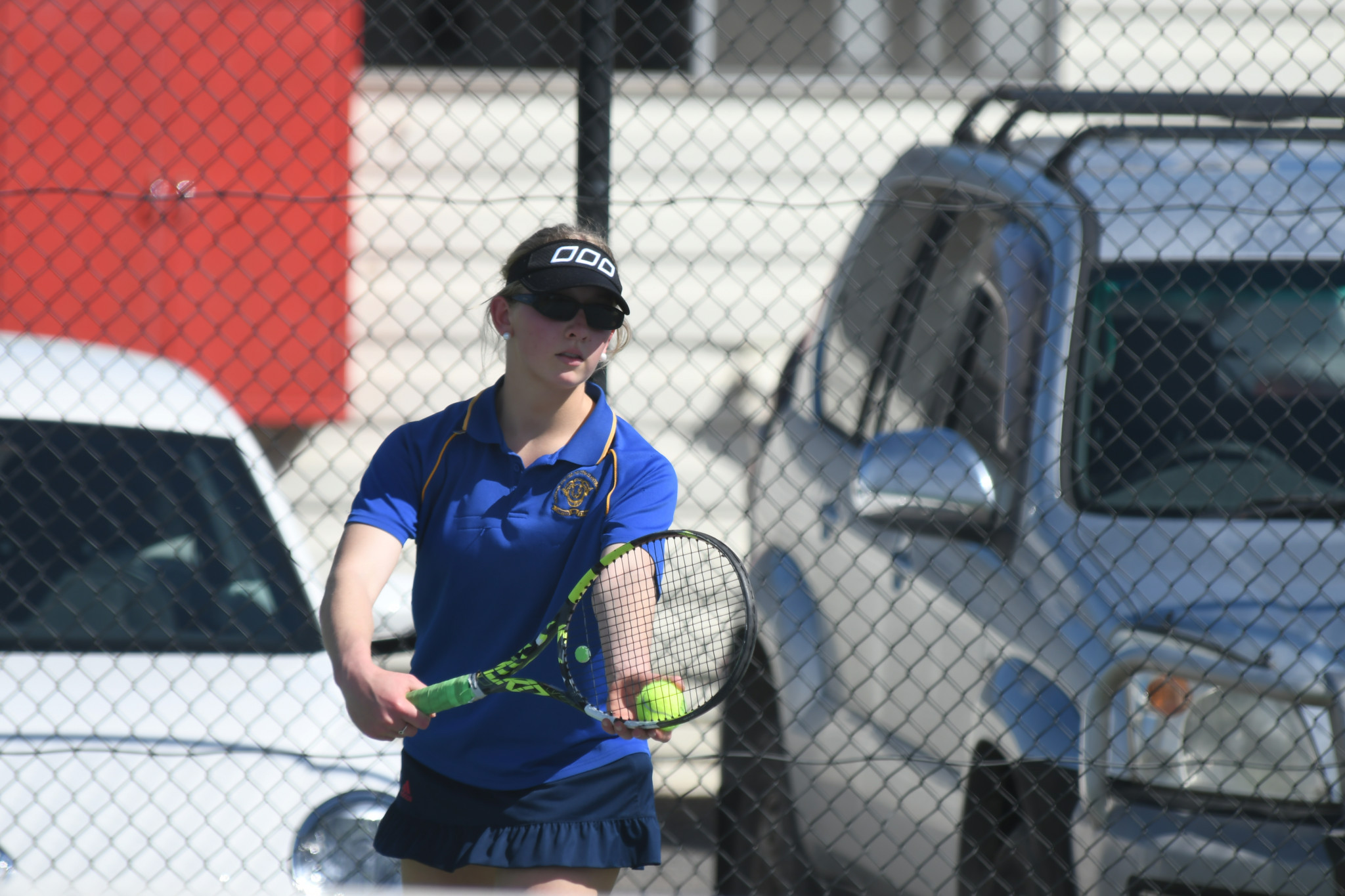 Natimuk's Victoria Brown prepares to serve in her A special singles match against Sarah Miller.