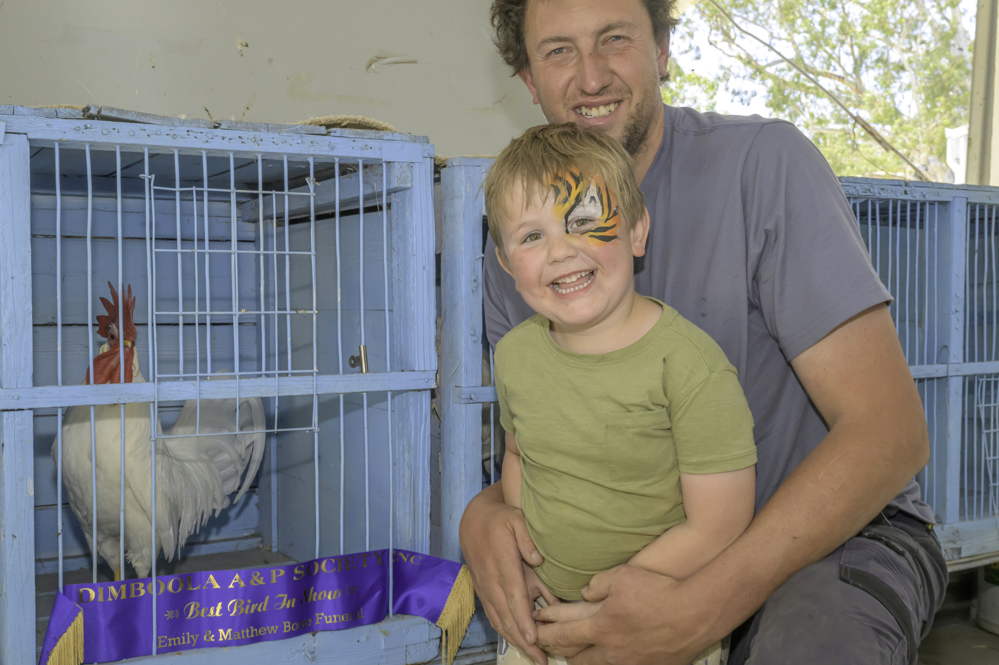 Nigel Zanker and Ben Zanker are all smiles after winning Best bird in the show.