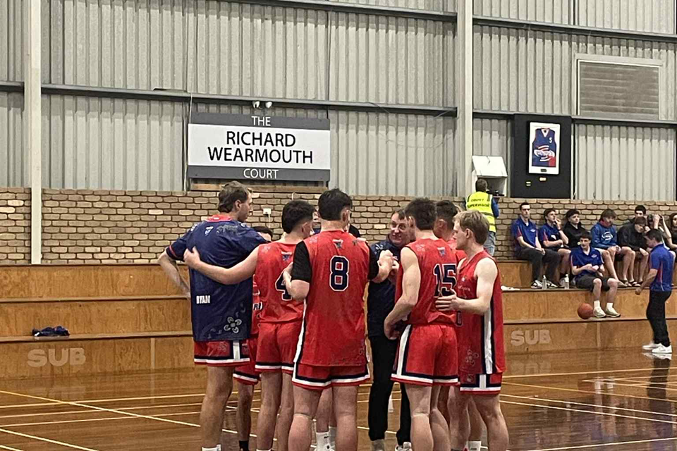 Horsham Hornets men's coach Scott Benbow talks with his side ahead of their clash against Terang.